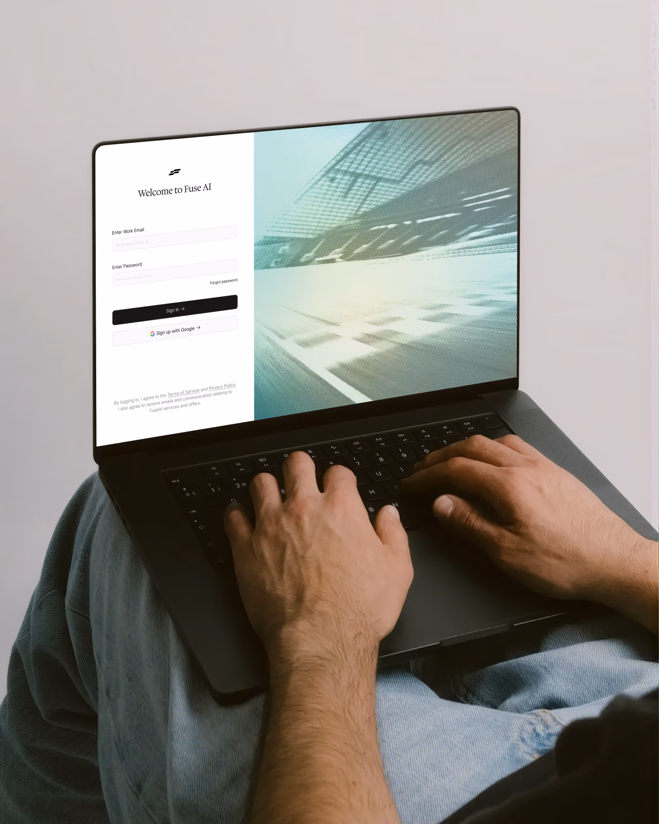 FuseAI login screen on a laptop