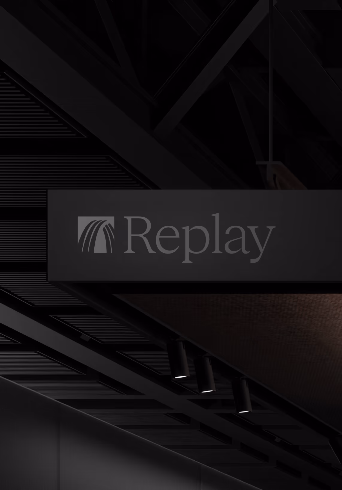 Replay sign in a dark lobby