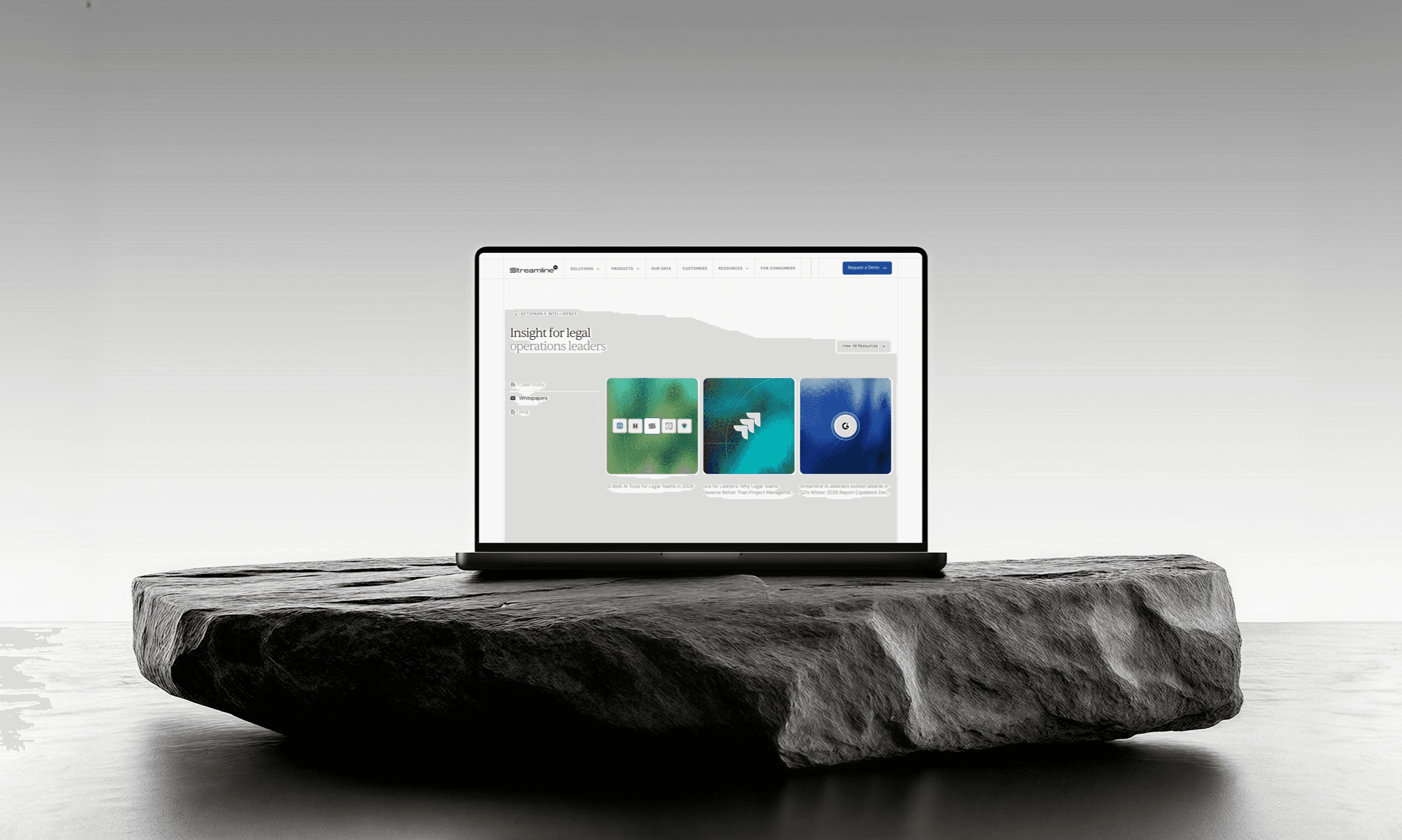 Streamline resources page on a laptop resting on a stone slab
